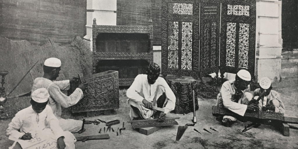 Wood carvers in a British-run workshop in Allahabad, c. 1903. Source Maffey, A Monograph on Woodcarving in the United Provinces of Agra and Oudh, 1903