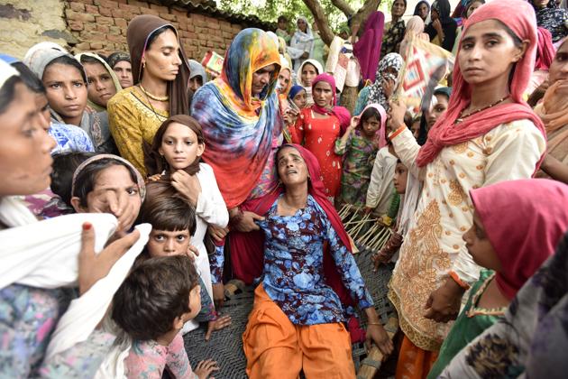 Asmina (centre), wife of Rakbar Khan, a victim of a mob lynching in Kolgaon, Haryana.