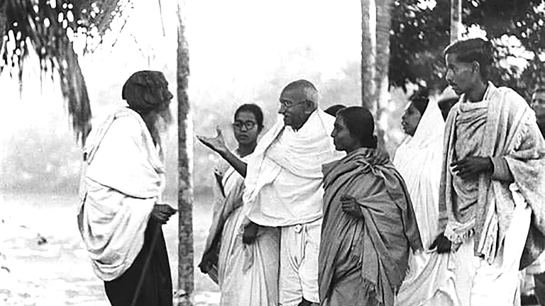 Gandhi speaking to Muslims in Nokhali.