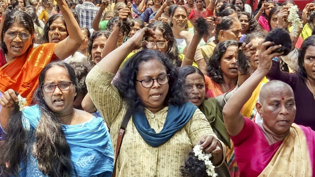 ASHA workers cut their hair during a protest, demanding an increase in their honorarium in Kerala 