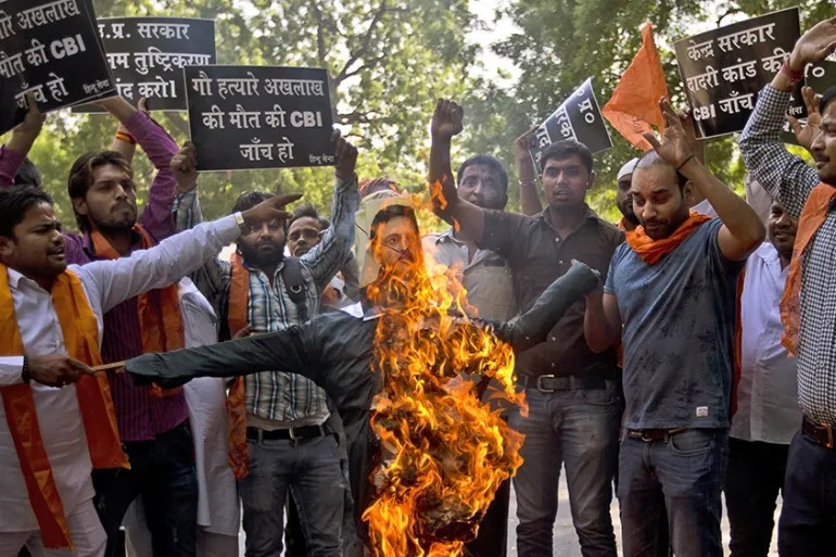 Activists of Hindu Sena protest against a government inquiry's conclusion that Mohammed Akhlaq, victim of mob lynching in Uttar Pradesh, was not storing beef for consumption