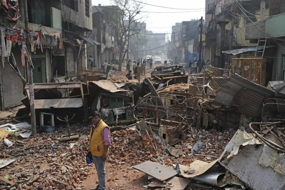 A municipal worker stands where communal clashes took place in New Delhi, India, February 27, 2020
