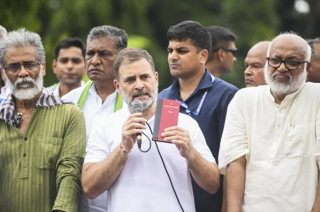 Congress leader Rahul Gandhi with CPI (ML) Liberation General Secretary Dipankar Bhattacharya and others addresses supporters during a protest amid ‘Bihar bandh’ called by the INDIA bloc against Special Intensive Revision in the state, in Patna