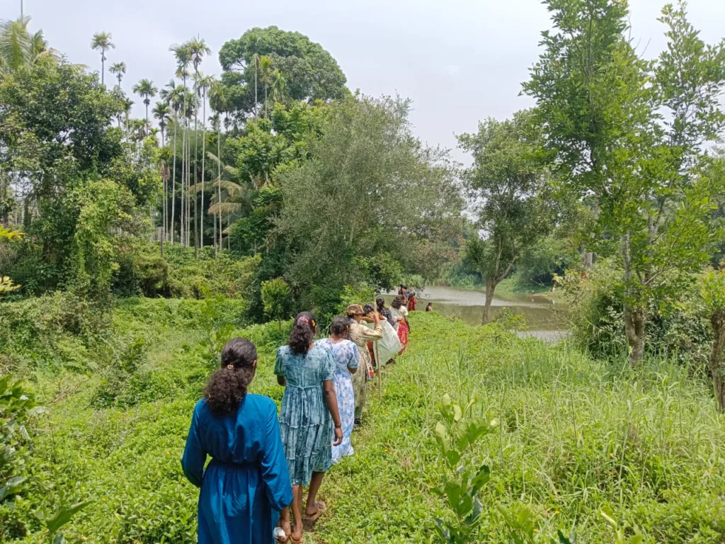 C F John and other artists walk in the forest of Wayanad