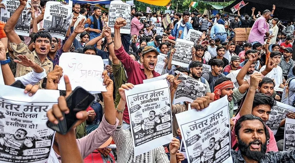 The youth-led protests at Jantar Mantar in New Delhi on July 22, 2026, where demonstrators held placards demanding accountability for examination irregularities and the resignation of Union Education Minister Dharmendra Pradhan.